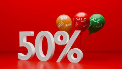 Bright red promotional image showcasing a 50% sale with balloons.