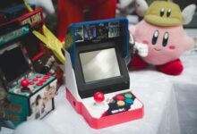 A collection of vintage arcade consoles and toys set in Tunis, Tunisia, evoking nostalgia.