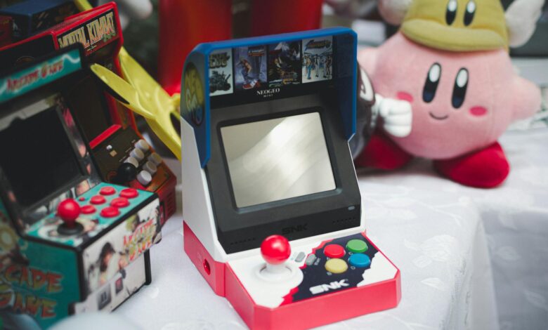 A collection of vintage arcade consoles and toys set in Tunis, Tunisia, evoking nostalgia.