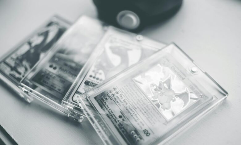 Close-up of collectible Pokemon cards in protective cases, emphasizing preservation and value.