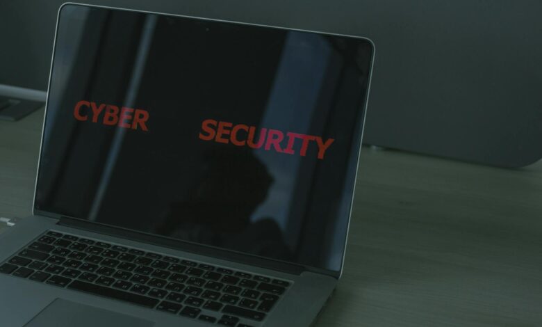 Close-up of a laptop displaying cybersecurity text, emphasizing digital security themes.