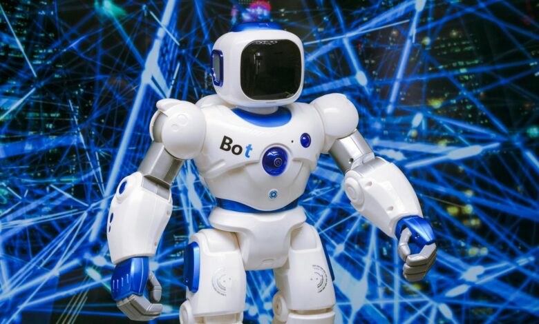 Advanced humanoid robot with glowing blue accents in a digital network setting.