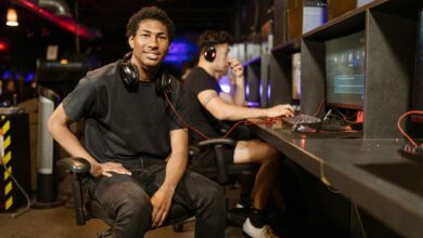 Two gamers playing at a modern gaming station, highlighting technology and e-sports.