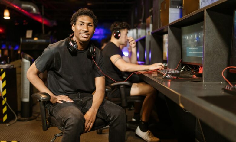 Two gamers playing at a modern gaming station, highlighting technology and e-sports.