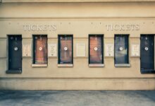 Row of closed ticket booths in Baltimore city center, showcasing urban architecture.