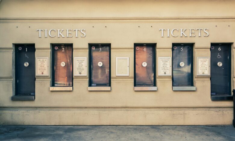 Row of closed ticket booths in Baltimore city center, showcasing urban architecture.