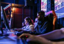 Serious gamers engage in a competitive esports event, highlighting focus and teamwork.