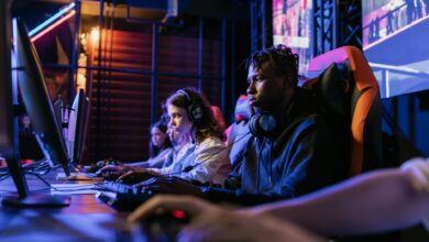 Serious gamers engage in a competitive esports event, highlighting focus and teamwork.