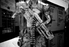 A black and white image of a cyberpunk soldier character in Tijuana, Mexico, holding a futuristic weapon.