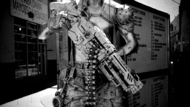 A black and white image of a cyberpunk soldier character in Tijuana, Mexico, holding a futuristic weapon.