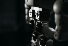 Detailed close-up of a robot's mechanical components, emphasized by moody studio lighting.