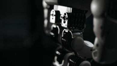 Detailed close-up of a robot's mechanical components, emphasized by moody studio lighting.