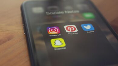 Smartphone displaying popular social media apps like Instagram, Pinterest, Twitter, and Snapchat.