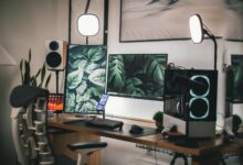 Stylish gaming and streaming setup with dual monitors, PC, and accessories.