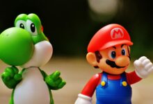 Detailed close-up of Mario and Yoshi figurines from a popular video game franchise.