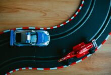 Colorful toy cars on a racing track, a perfect depiction of childhood fun and imagination.