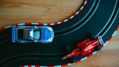 Colorful toy cars on a racing track, a perfect depiction of childhood fun and imagination.