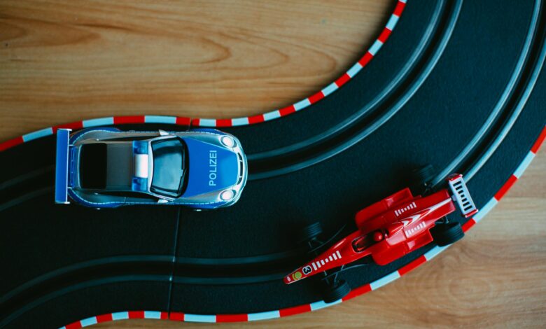 Colorful toy cars on a racing track, a perfect depiction of childhood fun and imagination.