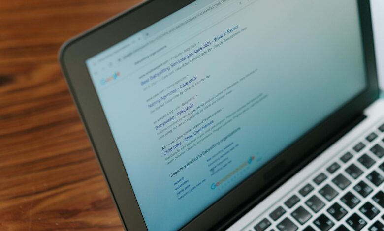 A close-up view of a laptop displaying a search engine page.