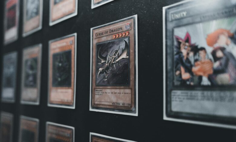 A close-up view of Yu-Gi-Oh! trading cards in a display case showcasing rare and collectible cards.