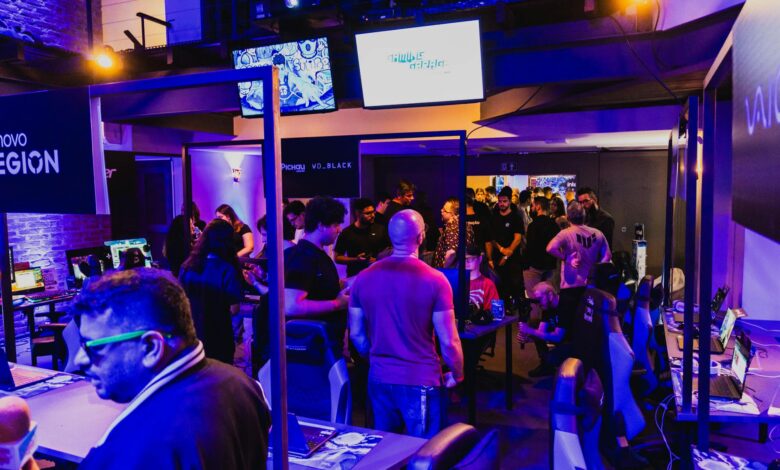 Vibrant arcade room filled with gamers participating in a competitive tournament under violet lighting.