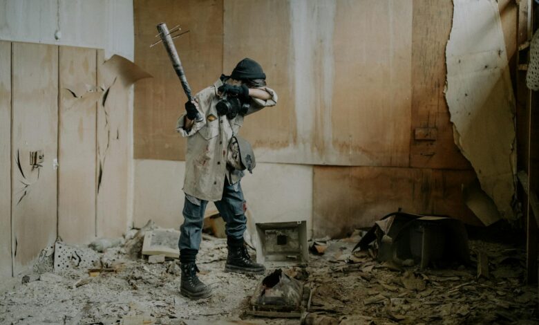 A dramatic post-apocalyptic scene with a masked figure holding a weapon in a dilapidated room.