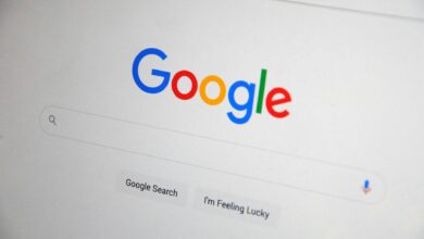 Close-up of the Google homepage on a screen showing search options.