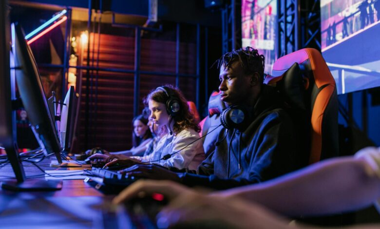 Serious gamers engage in a competitive esports event, highlighting focus and teamwork.