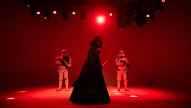 Star Wars characters in dramatic red lighting on a stage. Perfect for entertainment-themed imagery.