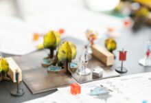 Detailed setup of a tabletop role-playing game with miniature figures and dice in San José, Costa Rica.
