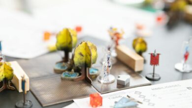 Detailed setup of a tabletop role-playing game with miniature figures and dice in San José, Costa Rica.
