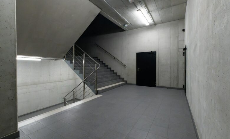 A modern and minimalist concrete stairwell showcasing industrial architecture.