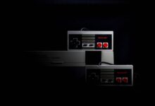 Retro gaming controllers from the Nintendo Entertainment System in low-key lighting, evoking nostalgia.