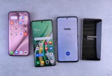 Four modern smartphones showcasing home screens, applications, and startup logos on a sleek surface.