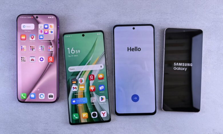 Four modern smartphones showcasing home screens, applications, and startup logos on a sleek surface.