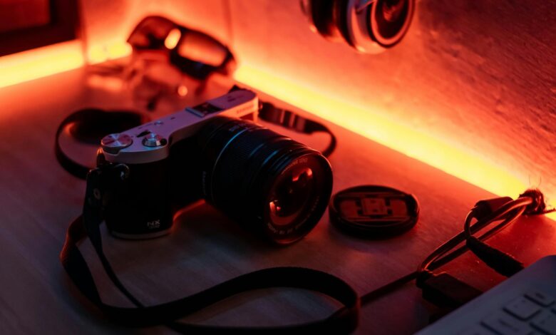 Retro camera on a desk with warm ambient lighting, evoking a nostalgic vibe.