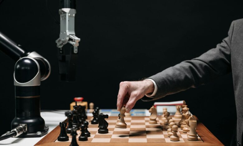 A robotic arm plays chess against a human, symbolizing AI innovation and strategy.