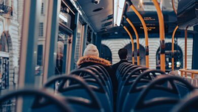 Passengers traveling on a city bus through London, capturing urban commuting life.