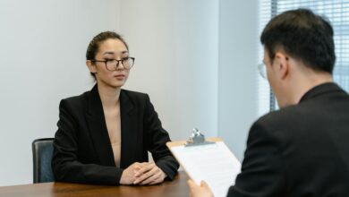 Business interview scene with professionals in office setting.