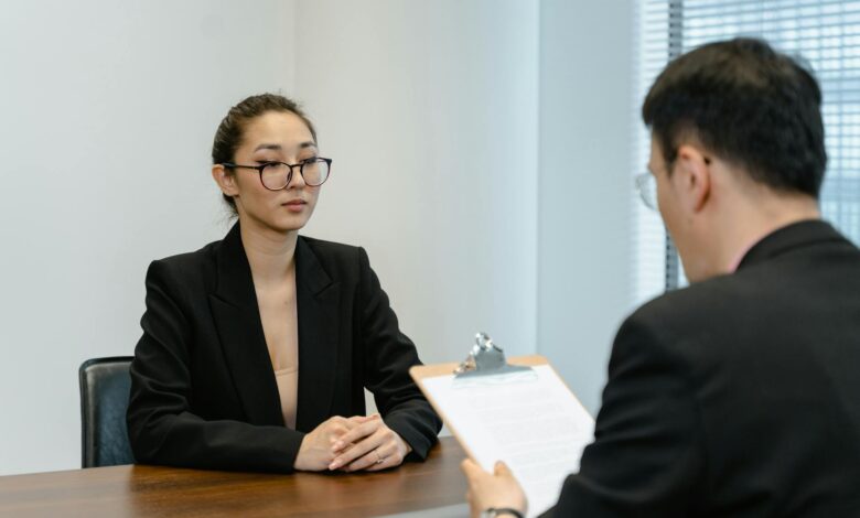 Business interview scene with professionals in office setting.