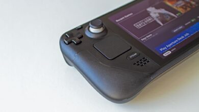 Detailed view of a handheld gaming console showcasing game selection on its screen.