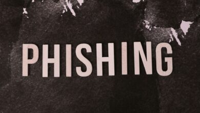 Abstract representation of phishing with the text on a textured dark surface.