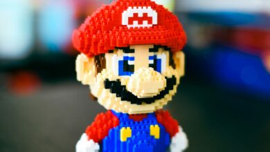A vibrant block construction toy figure resembling a famous video game character in a playful pose.