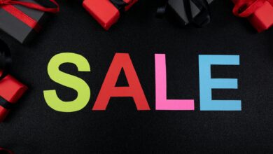 Vibrant SALE text surrounded by gift boxes offers perfect promotional imagery.