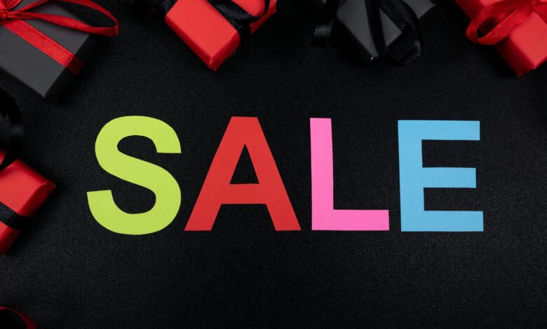 Vibrant SALE text surrounded by gift boxes offers perfect promotional imagery.
