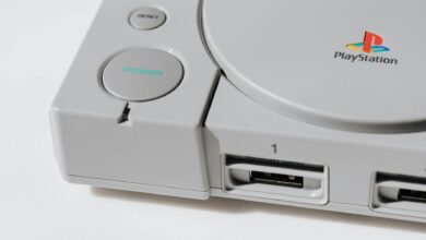 Close-up view of a classic PlayStation gaming console from the 90s, showcasing its iconic design.