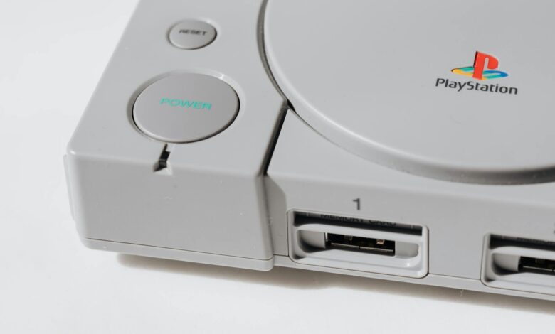 Close-up view of a classic PlayStation gaming console from the 90s, showcasing its iconic design.
