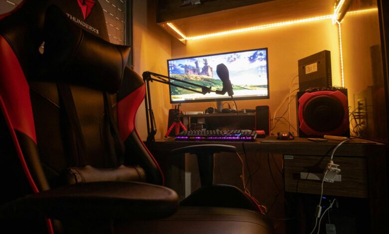 A dimly lit room showcasing an advanced gaming desktop setup with modern equipment.