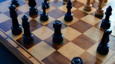 Chessboard with black and white pieces showcasing strategic positioning.