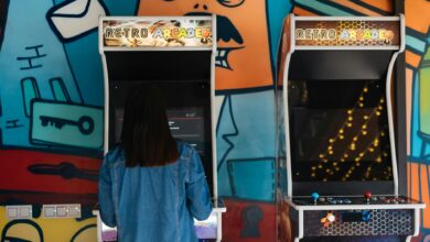 Woman engages in retro arcade gaming in a vibrant, graffiti-themed environment.